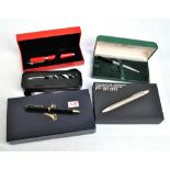 A group of various pens including a Ferrari ballpoint, a silver bodied Montegrappa,