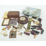 A collection of pipes and cigarette holders (some cased), period photographs, buttons,