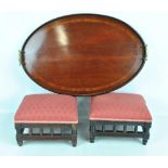 An early 20th century mahogany tray and two footstools (3).