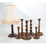 Three pairs of oak barleytwist candlesticks, the tallest 26cm, and a similar table lamp (7).