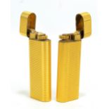 Two Cartier gold plated cigarette lighters (2).