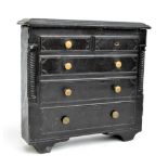 A Victorian Welsh slate doorstop modelled as a chest of two over three drawers, width 25cm.