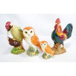 BESWICK; four figures 1892 'Leghorn', two owls and 1218 'Woodpecker' (4).