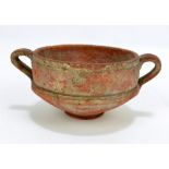 A Roman pottery twin handled footed vessel,