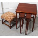 A contemporary nest of three mahogany tables on turned tapering supports and a small early-to-mid