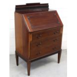 An Edwardian mahogany bureau, fluted top rail,