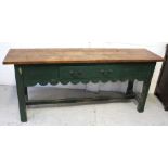 A pine sideboard with painted base and stretchered supports, width 182cm.