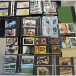 A quantity of albums containing mainly contemporary topographical postcards.