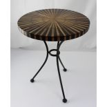 A small circular ebonised and bamboo occasional table on black metal tripod base, 53 x 40cm.