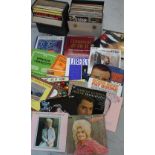 A quantity of records contained in two carrying cases and a quantity of loose records,