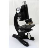 A cased Beck of London model 47 microscope numbered 31940, height 31cm.