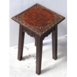 A small carved oak occasional table, width 31cm.