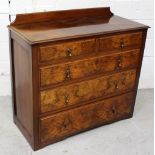 A reproduction walnut chest of two-over-three drawers on plinth base, width 103cm.