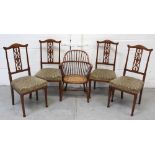 A set of four 20th century Edwardian-style dining chairs with central carved back splat to front