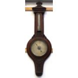 A Victorian carved mahogany aneroid barometer and thermometer, length 98cm.
