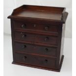 A miniature four-drawer mahogany chest, 42 x 39cm.