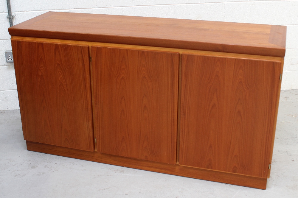 A retro Skovby of Denmark teak sideboard, three doors on plinth support, length 144cm.