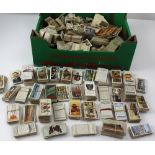 A large quantity of cigarette cards to include John Player & Sons, royalty-related examples,