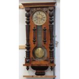 A 19th century mahogany-cased Vienna-style eight-day wall clock,