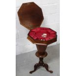 A Victorian walnut octagonal sewing box on octagonal column to tripartite support,