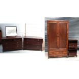 A retro Stag bedroom suite comprising a two-door wardrobe, height 199cm, width 106cm,