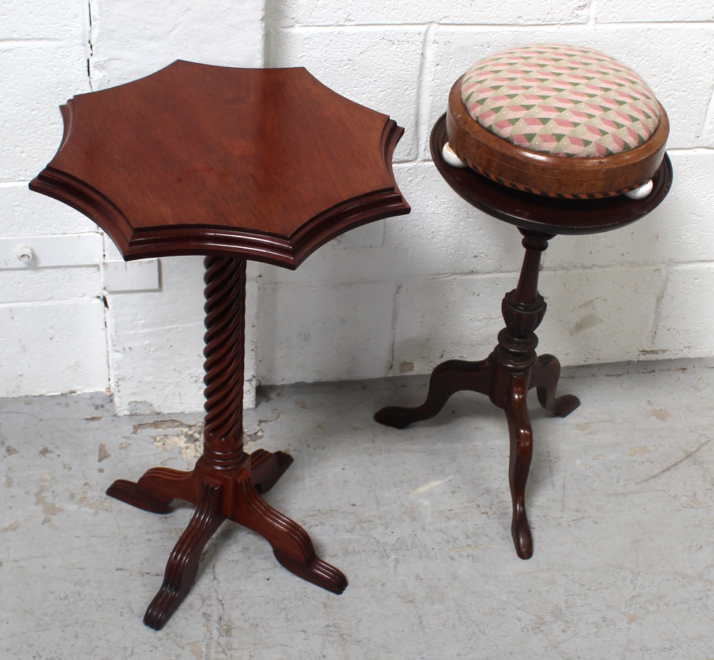 A mahogany wine table on turned central column and trefoil support,