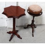 A mahogany wine table on turned central column and trefoil support,