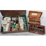 A vintage chemistry set to include test tubes, funnel and beakers,