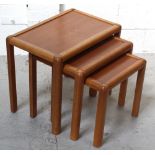 A nest of three retro tables.