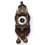 A contemporary mahogany-cased wall clock with brass figural decoration,