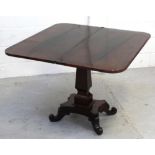 A Victorian rosewood fold-over rectangular tea table on spreading rectangular column above