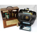 A nurse's vintage black leather bag containing a stethoscope, masks, blood sample bottles,