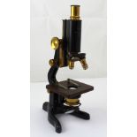 A cased W Watson & Sons Ltd of London 'Service' microscope numbered 38265, height 31cm.