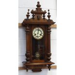 A mahogany-cased Vienna-style eight-day wall clock, the dial set with Roman numerals,