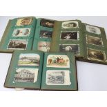 Five postcard albums containing photographs,