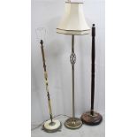 Three standard lamps to include an oak example with turned column to stepped circular base,