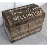 A late 19th/early 20th century wood and canvas travel trunk with dome top,