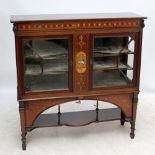 A circa 1900 mahogany and inlaid display cabinet centred with a panel depicting semi-nude female