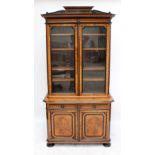 A late 19th century French burr walnut and ebonised bookcase on cupboard,