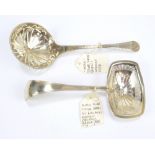 A late 19th century Dutch silver sifting spoon with pierced bowl and a further example with rounded