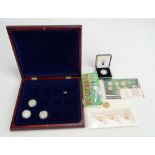 A group of football themed coins comprising three 585 gold World Champion England 1966 miniature