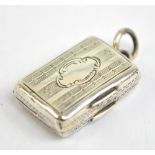 A mid-19th century hallmarked silver miniature vinaigrette with engraved detail and pierced grille,