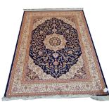 A blue ground Keshan carpet, 230 x 160cm.