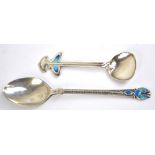 LIBERTY & CO; a George V hallmarked silver coffee spoon with enamel decorated terminal,