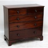 A mahogany chest of two short over three long drawers on bracket feet, 106 x 110cm.