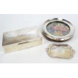 Three variously hallmarked silver items comprising a circular photograph frame, Sanders & MacKenzie,