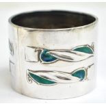 WILLIAM HAIR HASELER; an Edwardian hallmarked silver and enamel decorated napkin ring,