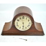 A 1940s mahogany mantel clock with Arabic numerals to the dial and a gilt framed wall mirror (2).