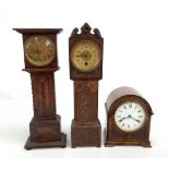 Two oak cased miniature longcase clocks, the dials set with Roman and Arabic numerals respectively,