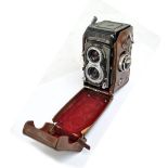 ROLLEIFLEX; a Franke & Heidecke leather cased camera, no.T2151870 beneath the lower lens.